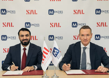 Faisal AlBedah (left) and Philipp Joeinig signing the MoU